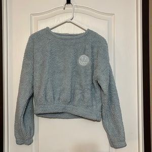 Fuzzy cozy material size L this shirt is a short shirt